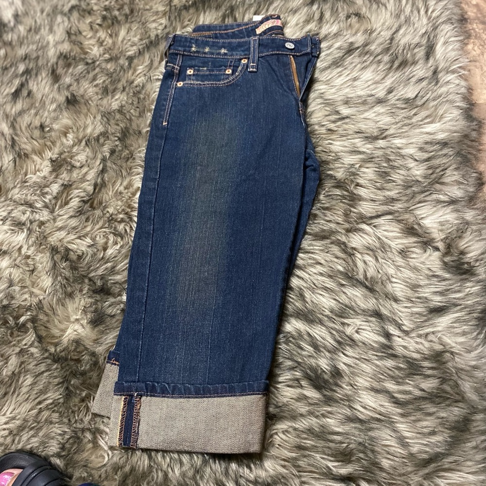 Woman blue jeans capris